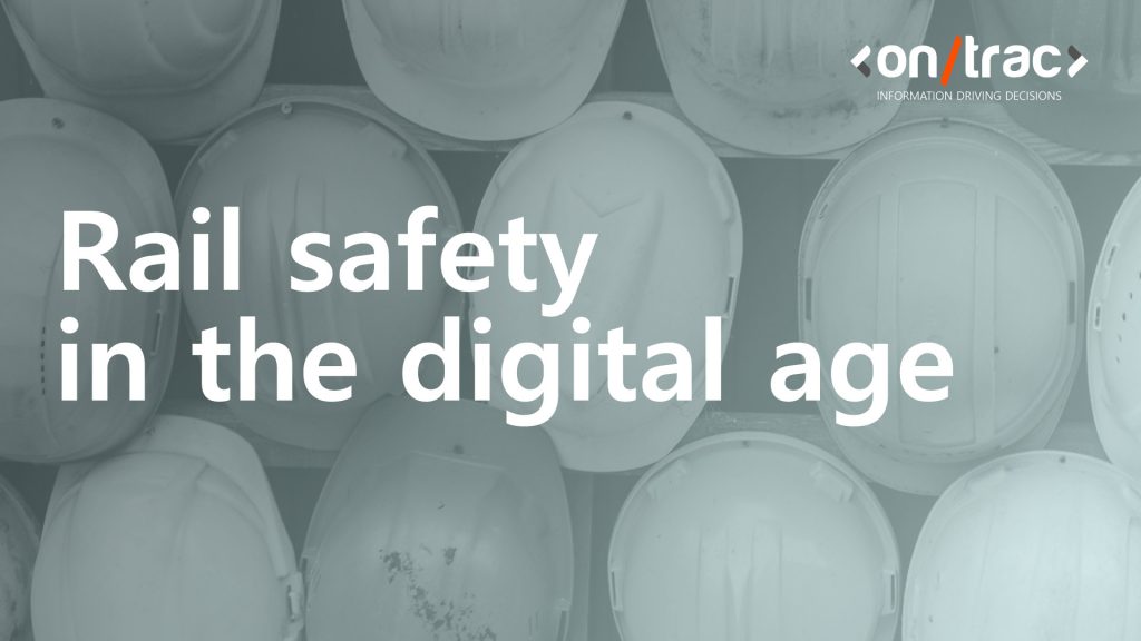 Rail worker hard hats hanging on a wall, with a blue layer over the front, with the words 'rail safety in the digital age' at the front of the image.