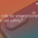 Closeup of a smartphone camera with overlayed text saying 'What role do smartphones play in rail safety?'